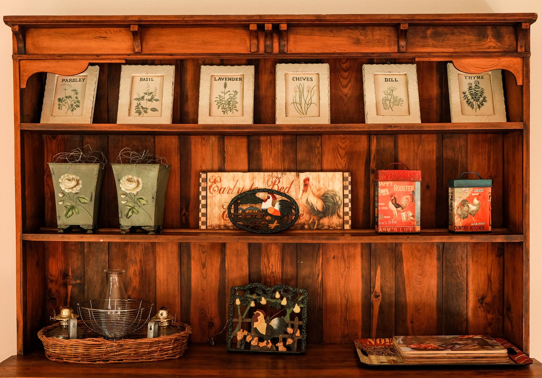 Painted farmhouse hutch with plate rails and glass doors used for coffee storage